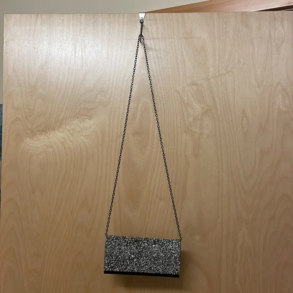 Saks Fifth Avenue sparkly gemstones clutch with chain link strap.